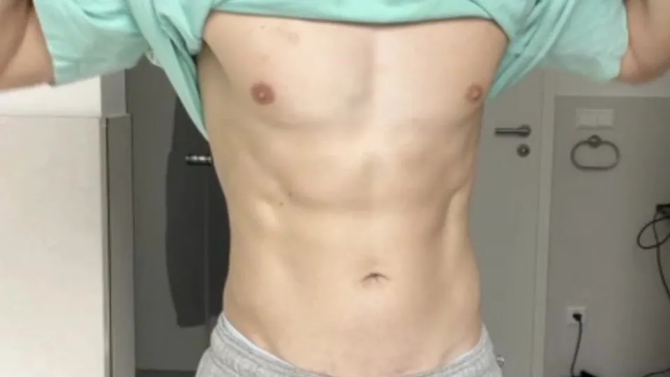 A blond guy masturbates and ejaculates