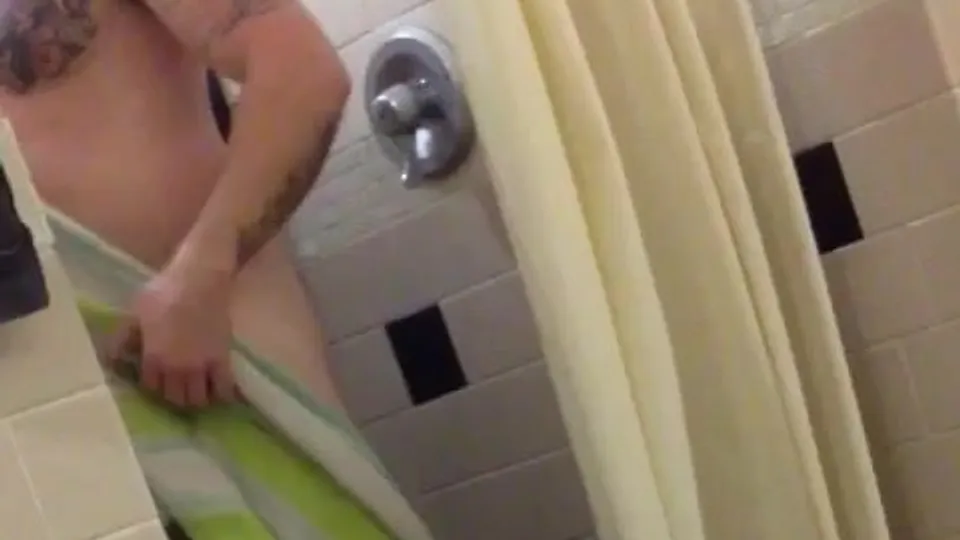 A tatted hottie on display after exits gym shower - ThisVid.com