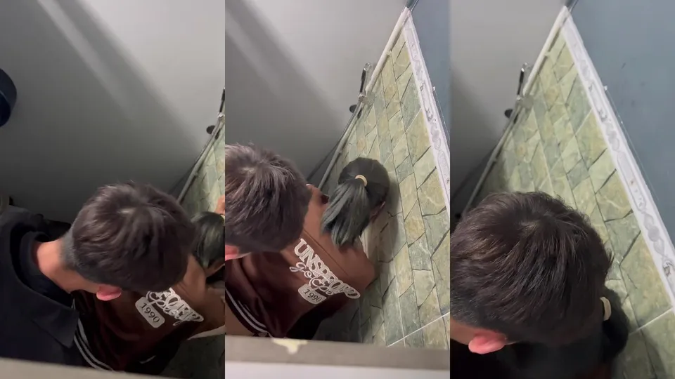 A young high school couple is having sex wildly in a stall in a public restroom, and the girl is enjoying herself  