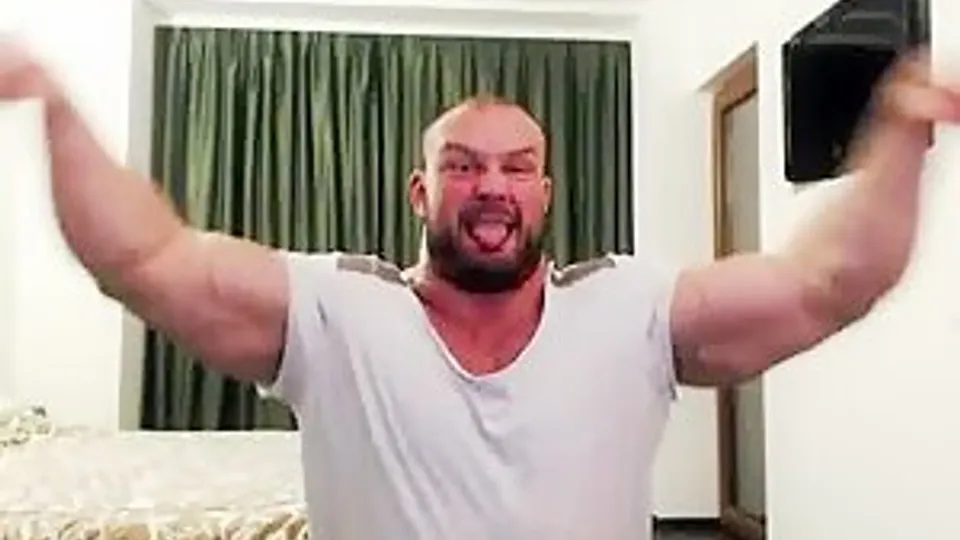 Alpha bodybuilder flexing hard