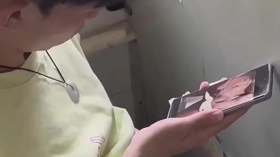 Asian twink cums watching gay porn in bathroom