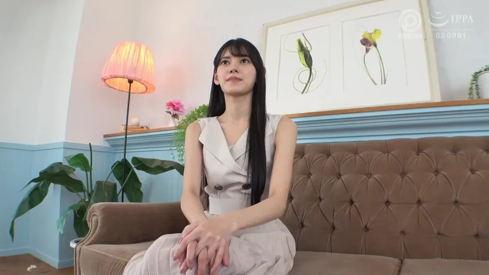 asian woman sitting on couch in living room
