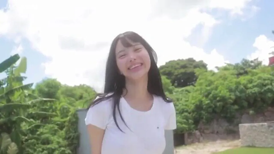 asian woman smiles outdoors