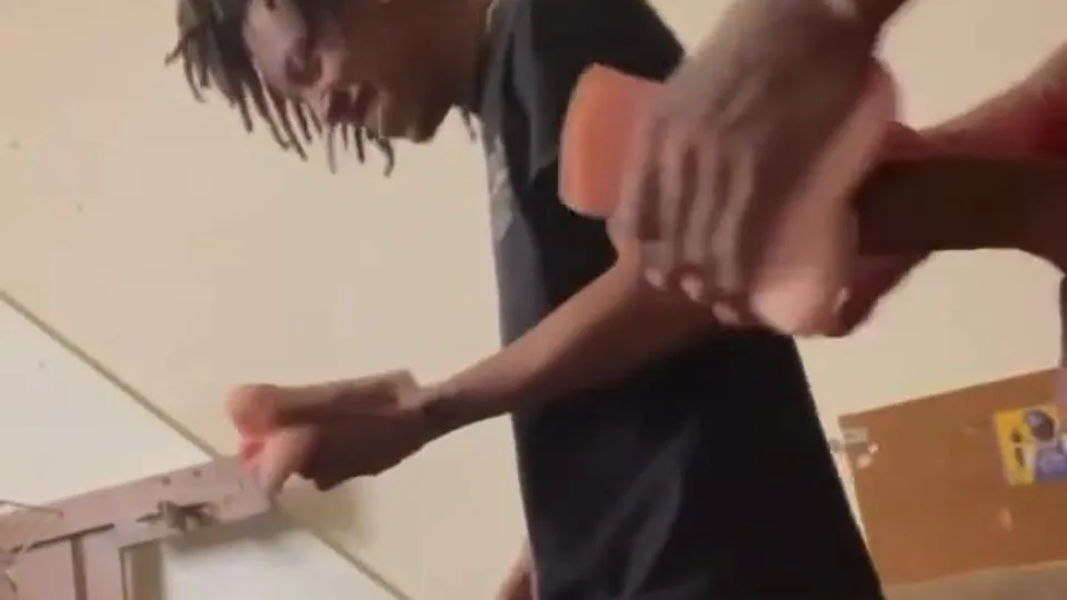 Black friend playing with toy - ThisVid.com