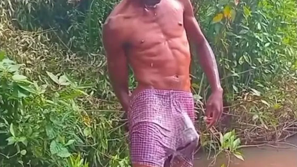 Black twink bathing outdoor with semi hard dick