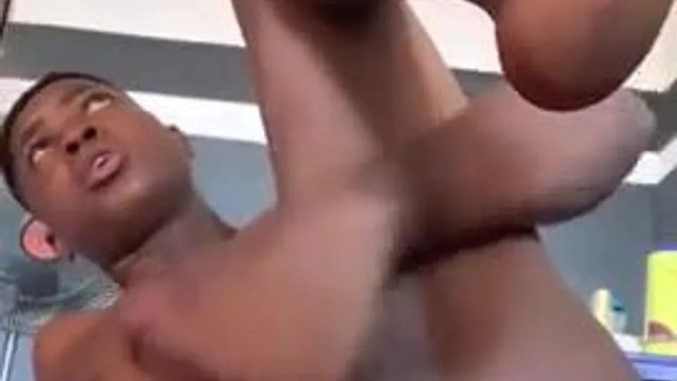 Black twink wanking and playing with his cum