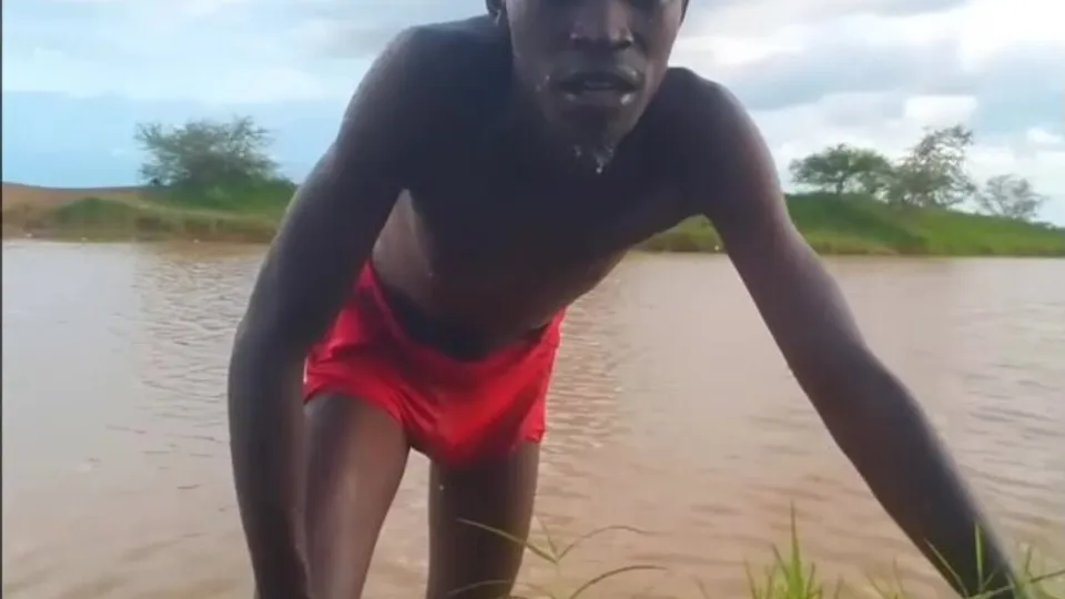Black villager bathing - ThisVid.com
