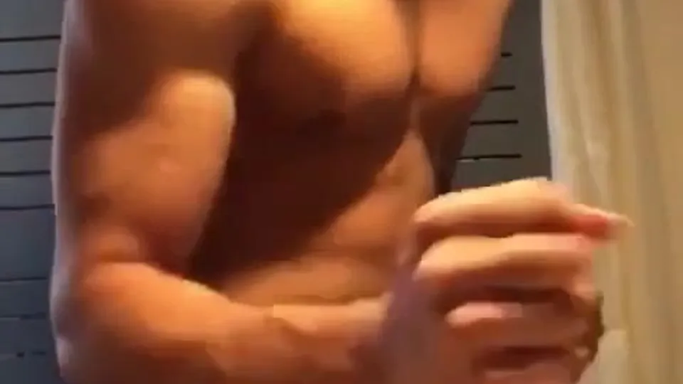Blue Shorts muscle boy flexes, strips and wanks