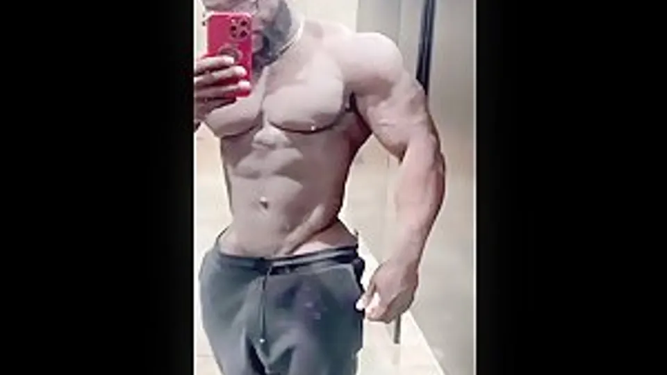 Bodybuilder Malachi Ezekiel flexing his muscles