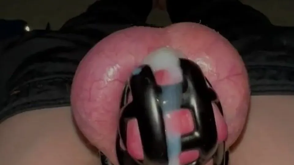Boy locked in chastity cums