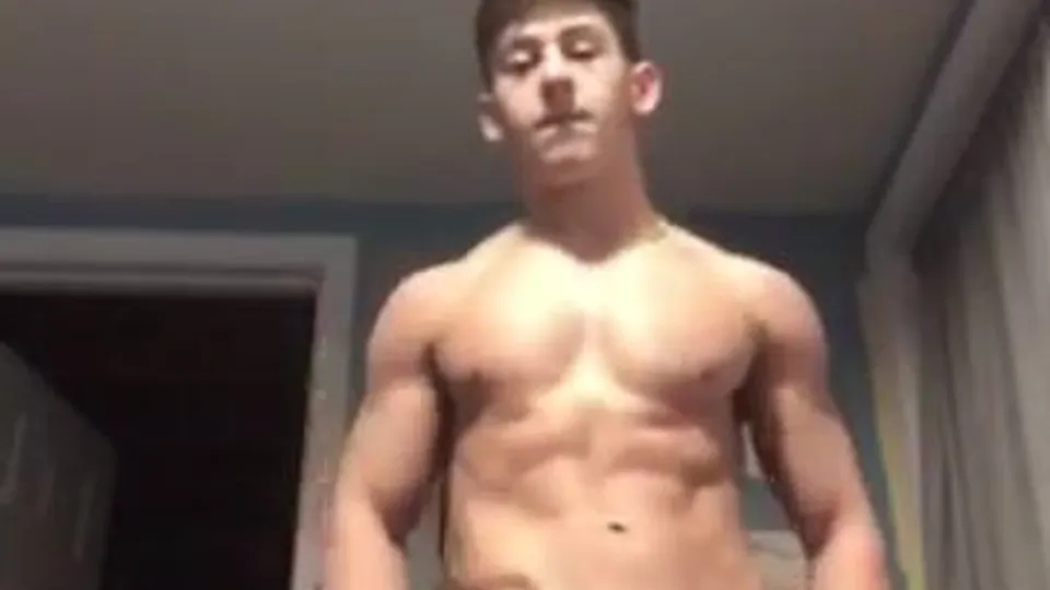 Brunette muscle boy strips