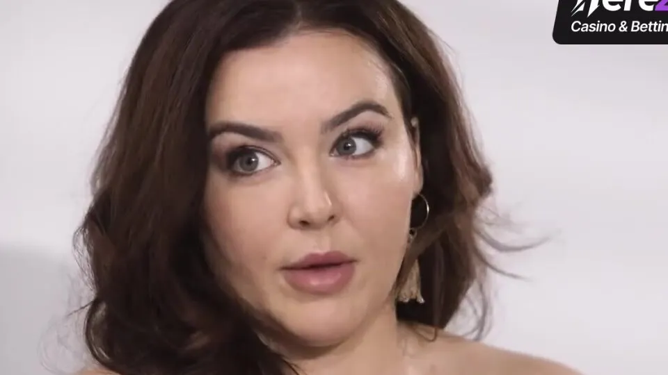 Busty dark-haired demonstrates off her huge boobs