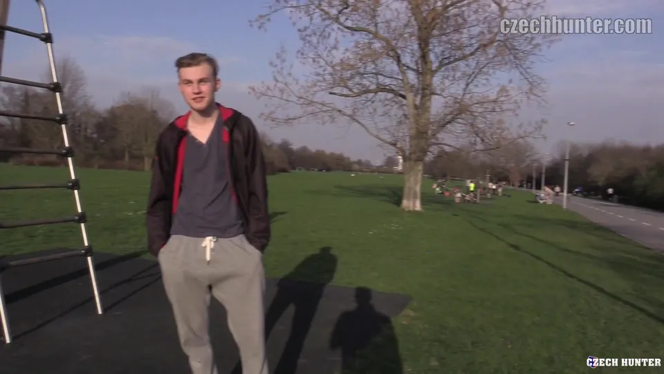 Young Guy in Grey T & Trackies Services Camera Guy