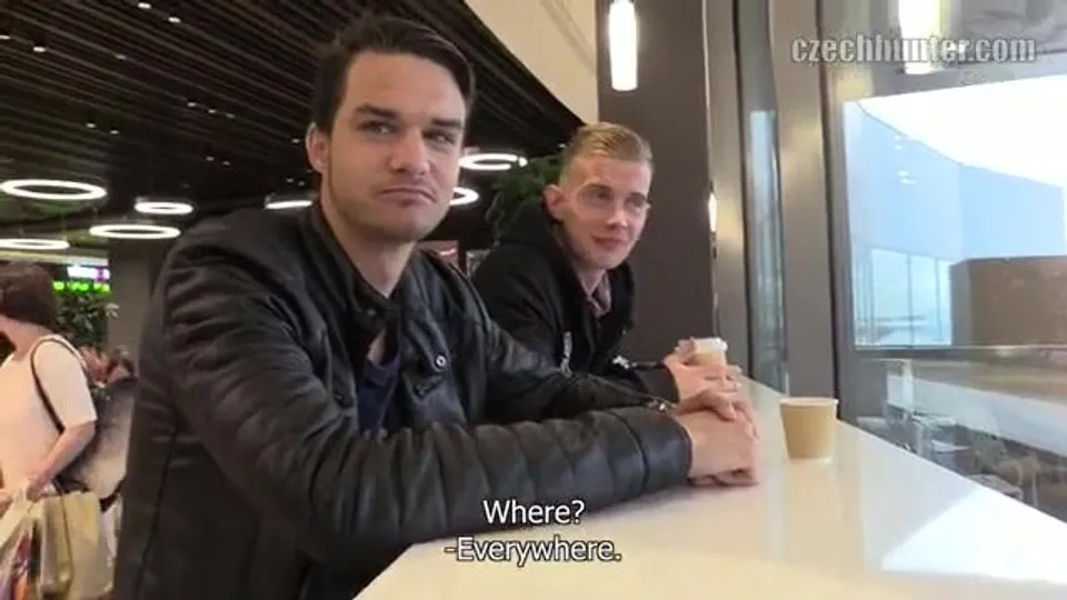 CH 315, Camera guy pays 2 young guys drinking coffee in a black jacket and a black "A