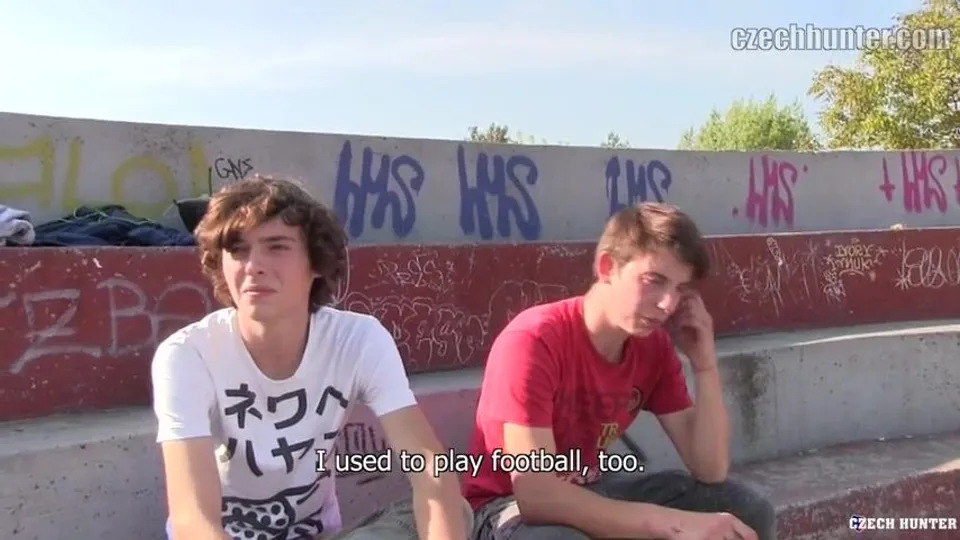CH 375, Camera guy pays 2 young guys, one in a white Japanese T, the other in a red "