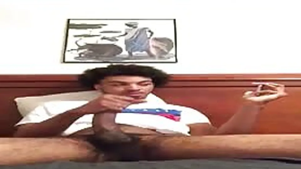 Cute young hairy black dude stroking his huge cock