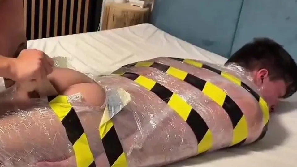 Dildo for completely wrapped teen bottom