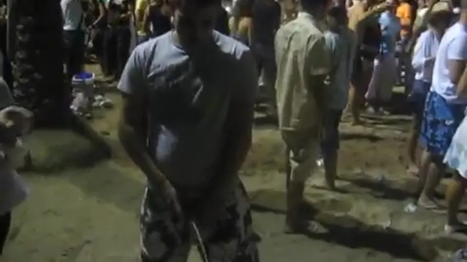 Drunk Man Pisses in Public at Festival