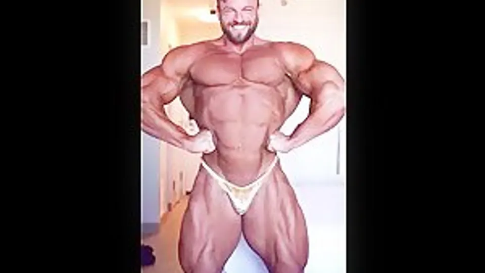 Eric Janicki flexing in gold posers