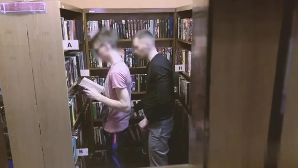 Gay couple having sex in the library porn