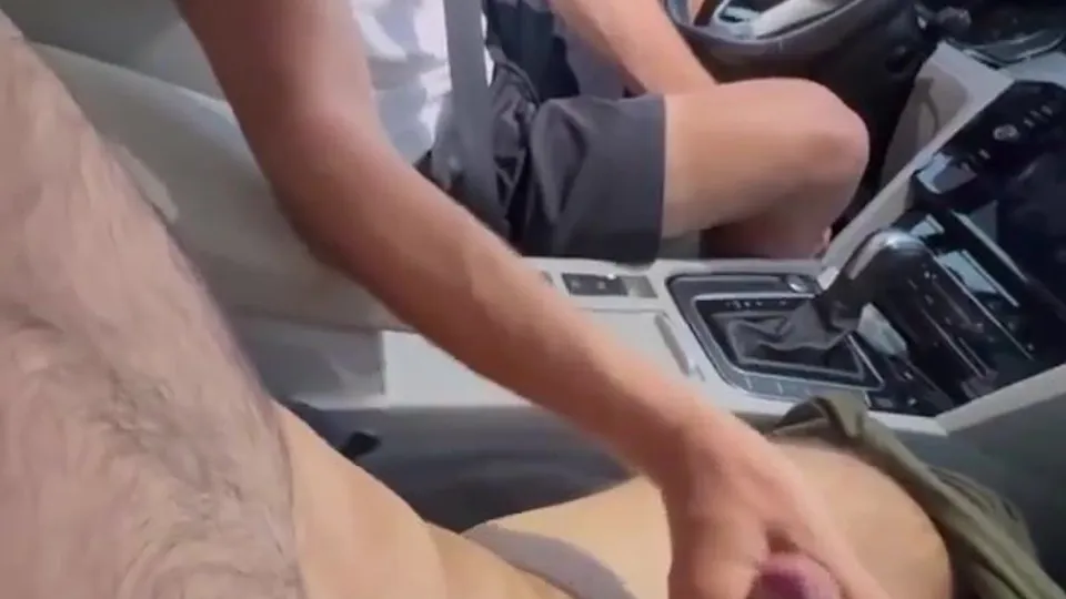 Giving daddy a handjob in his car