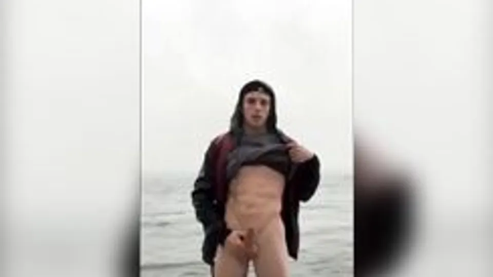 guy jerks off public on the beach in the sea