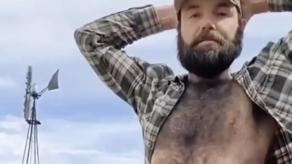 Hairy redneck showing off his erection in a field - ThisVid.com