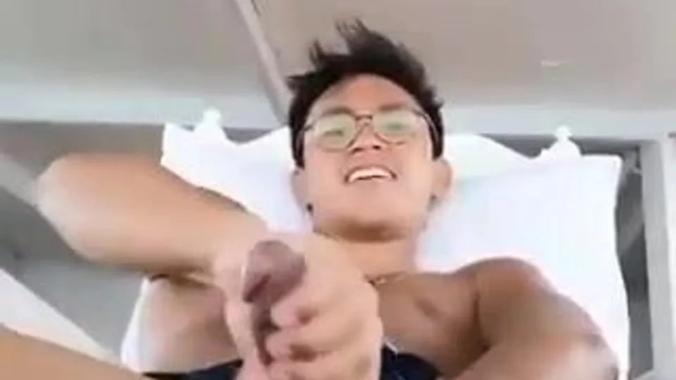 Handsome nerdy asian unloads
