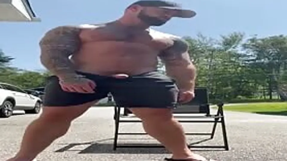 Handsome tattooed stud rubbing his huge tasty cock outdoor