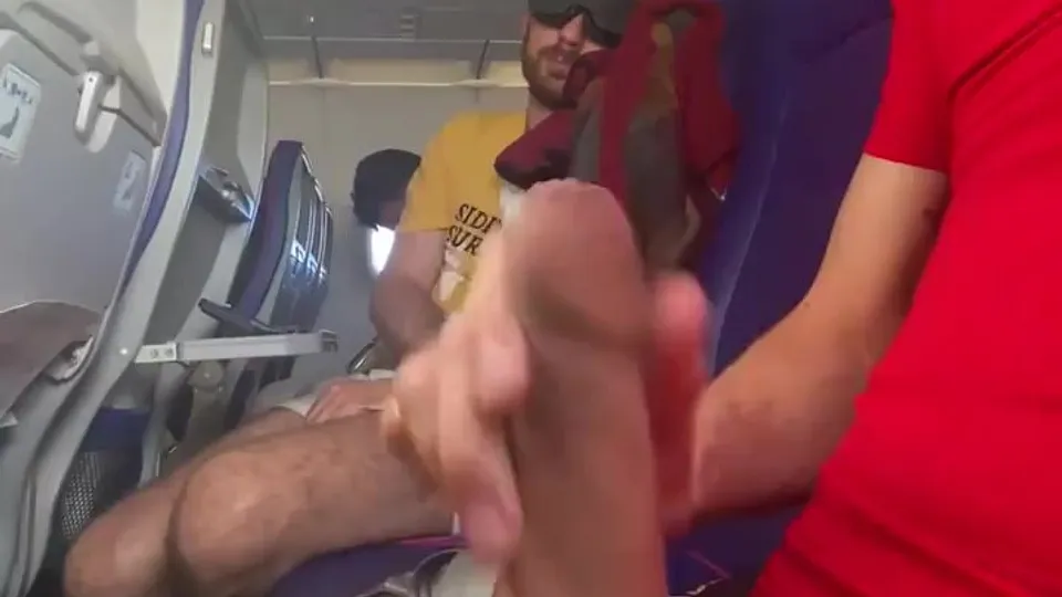 Horny guy wanks his uncut cock on plane during flight - ThisVid.com