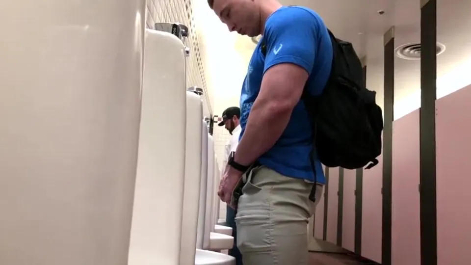 Guys Pissing at Urinal