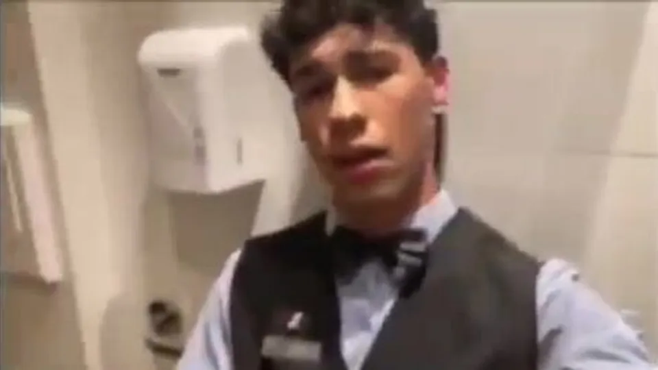 Hotel bellboy wants in a bathroom