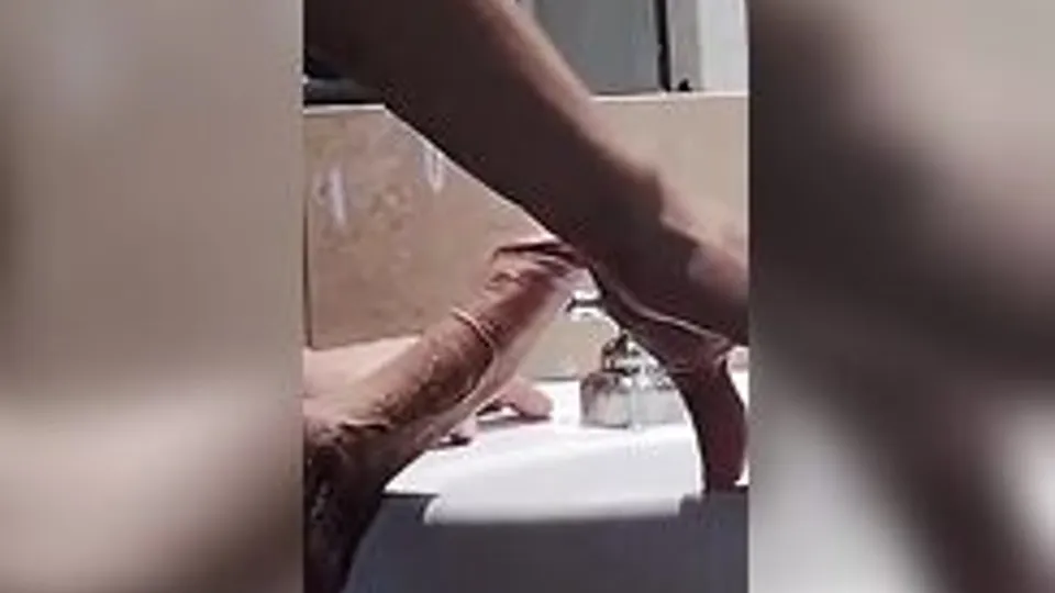 hung peeing hard on  cock