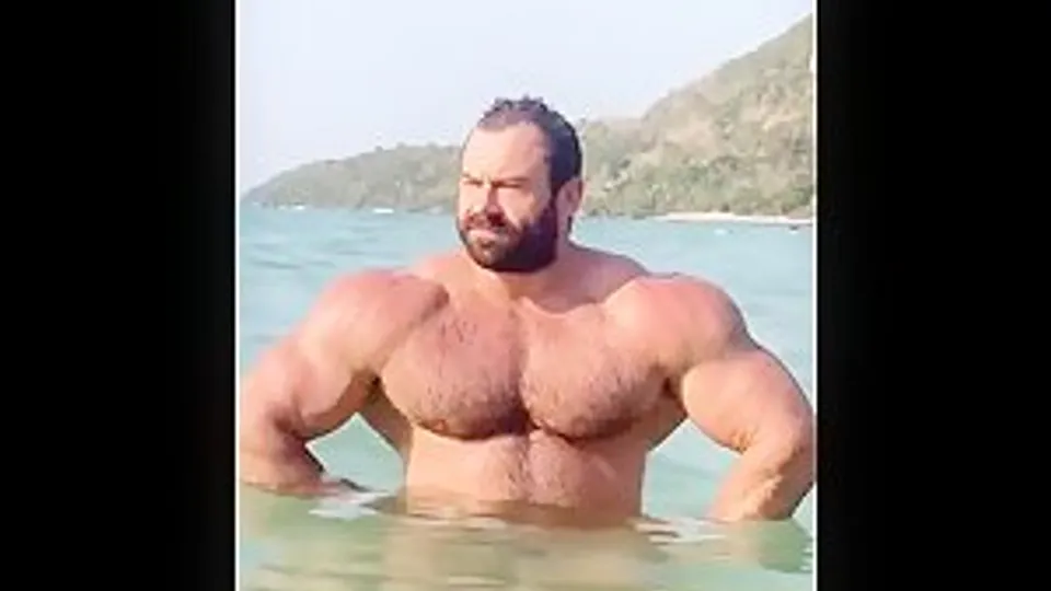 IFBB Pro bodybuilder Mikhail Maslov at the beach
