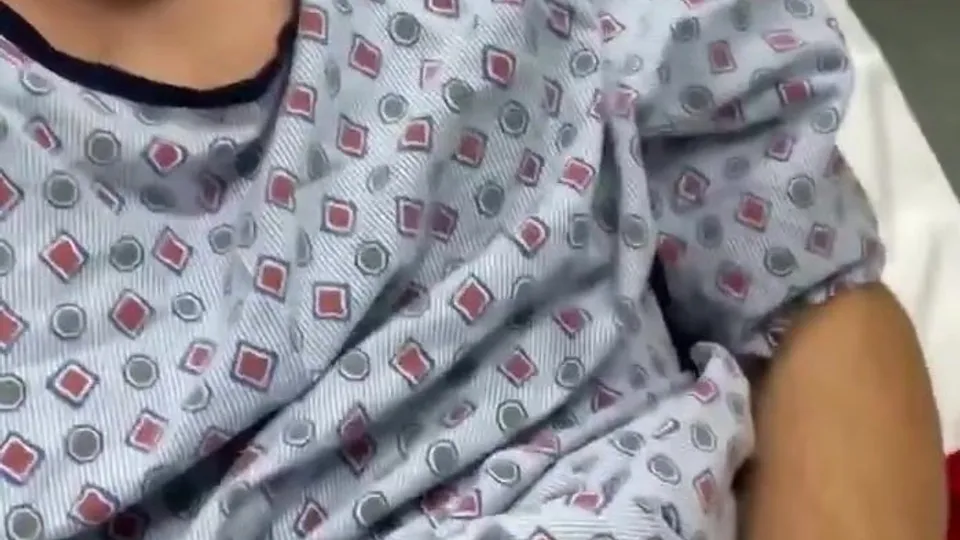 In the hospital room where anyone can walk in on him