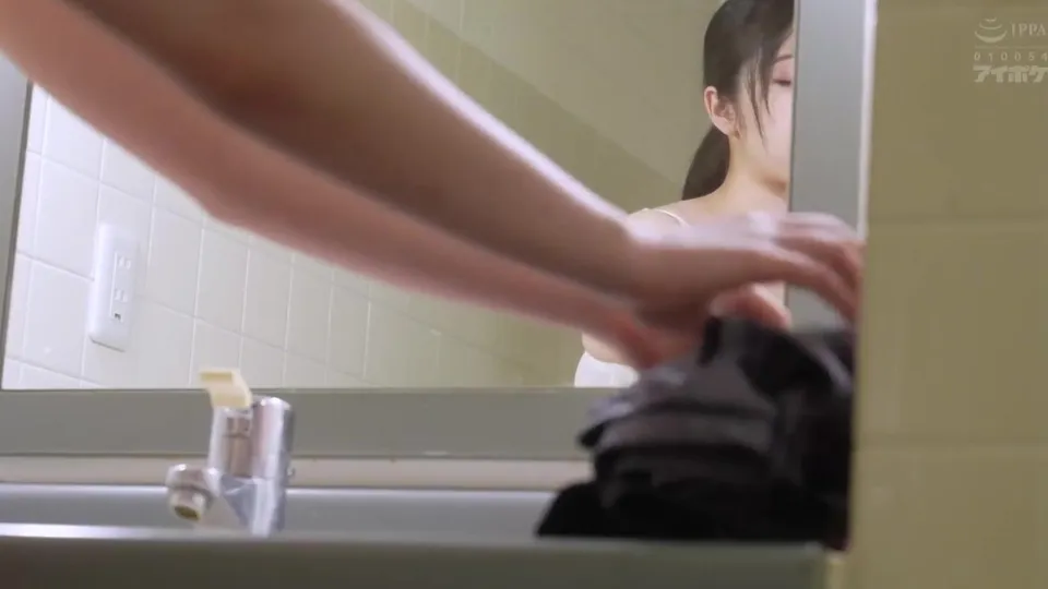Woman in bathroom, adjusting clothing