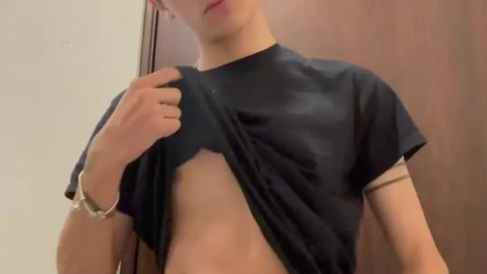 muscular guy undresses on webcam, revealing tattooed chest and stomach