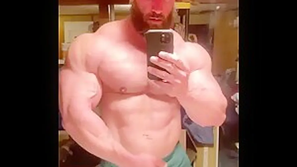 Lumberjack grunts and flexes his sweaty pumped body