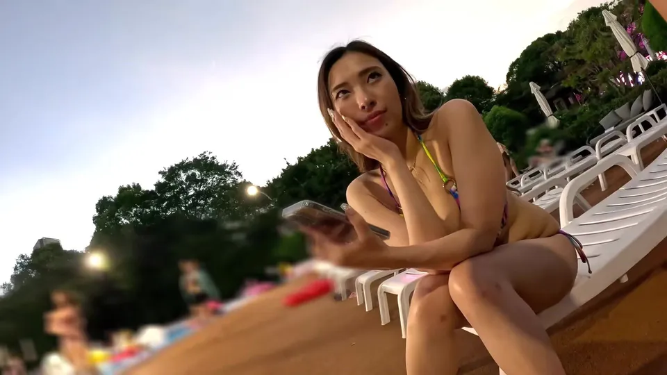 Asian Bombshell Teases Poolside in Colorful Bikini