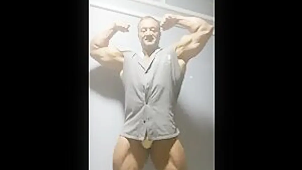 Muscle Daddy plays with his bulge in the basement