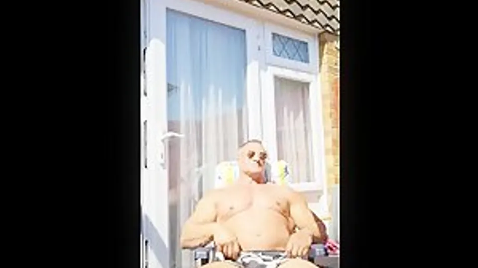 Muscle Daddy sunbathing and playing with himself