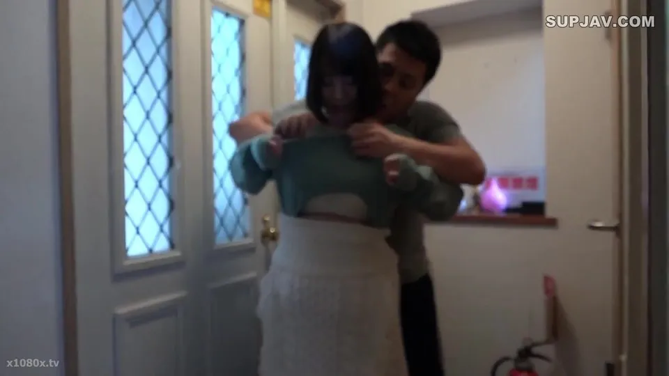 Man and Woman in Intense Hallway Encounter