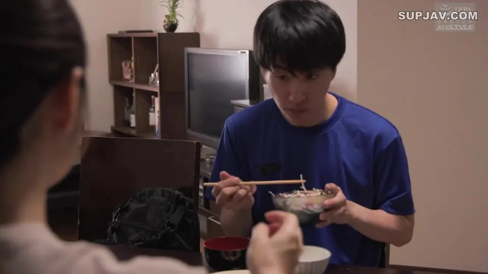 Asian Dude Eats Noodles While Another Watches