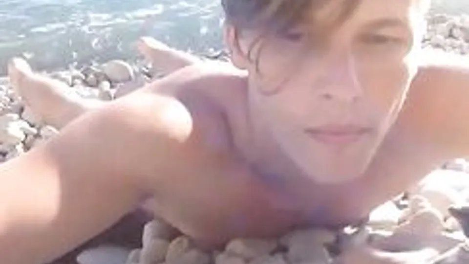 nudist on a peble beach