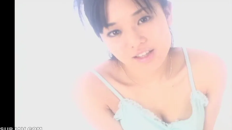 Asian Girl in Blue Top Teases Camera