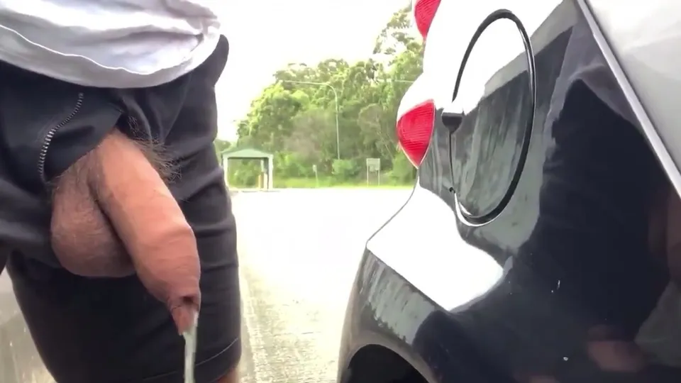 Outdoor pissing vid 4 - hung and uncut by the car - ThisVid.com