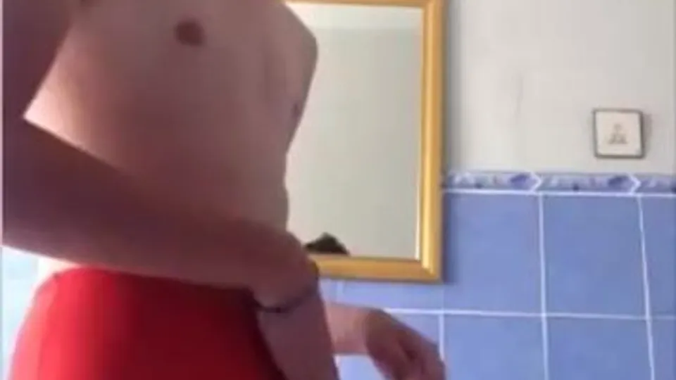 Red speedo twink wanks his dick