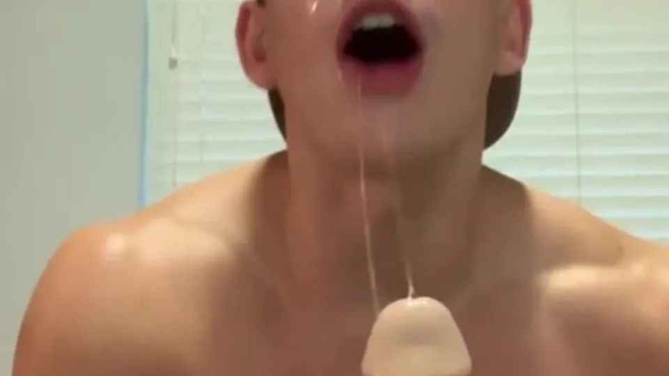 Reno Gold practices his dick sucking skills on a dildo