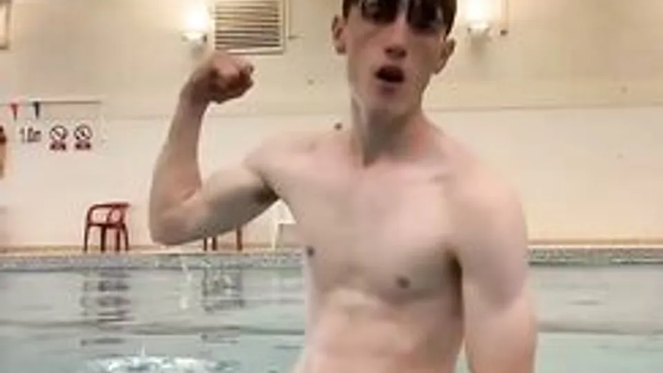 Ripped twink shows his dick in public swimming pool