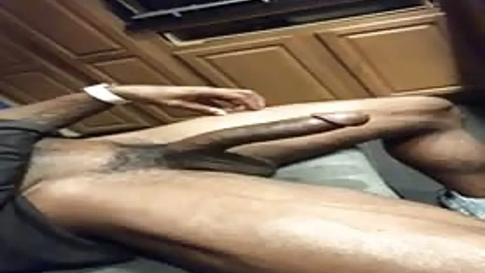 Sexy muscular basketball player stroking his cock in the kitchen